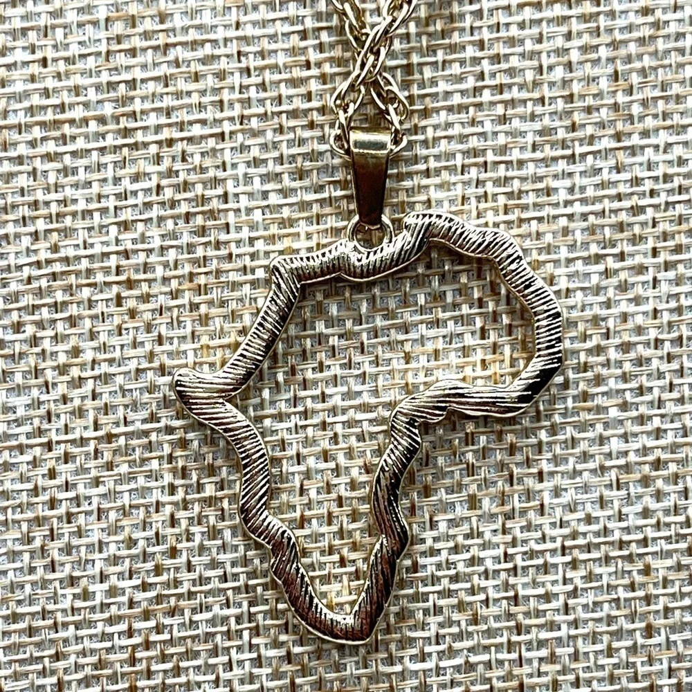Africa Pendant Outline Gold Tone with clear rhinestones! 18” gold tone necklace!